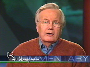Moyers in gray hair, orange sweater, blue shirt, with legend: "Bill Moyers Commentary" across bottom of screen