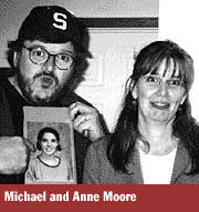 Michael Moore in trademark cap with sister Anne and photo of Anna McHugh