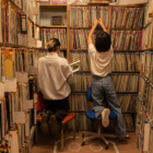 Two KDVS staffers browse the station's music library