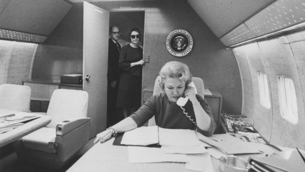 Liz Carpenter, a journalist who worked as an aide to President Johnson and Lady Bird Johnson, talks on the phone while working on Air Force One.