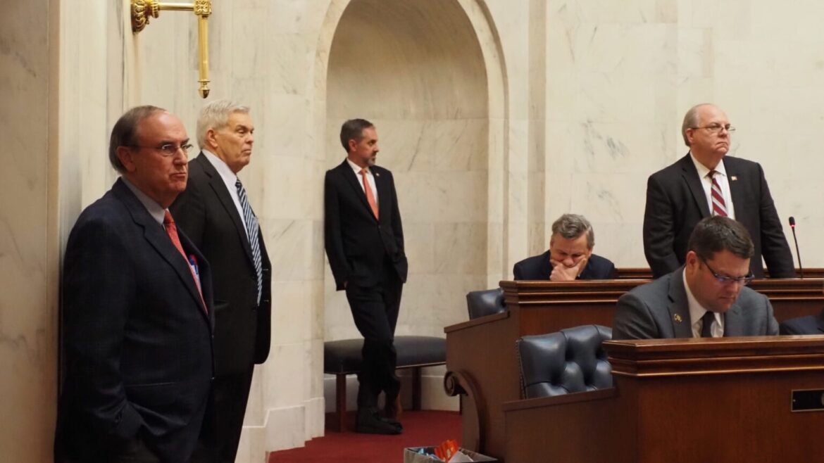 From left: Arkansas Sens. Mark Johnson, R-Ferndale; Dan Sullivan, R-Jonesboro; Greg Leding, D-Fayetteville; and Terry Rice, R-Waldron listen to debate on the Senate floor Monday.