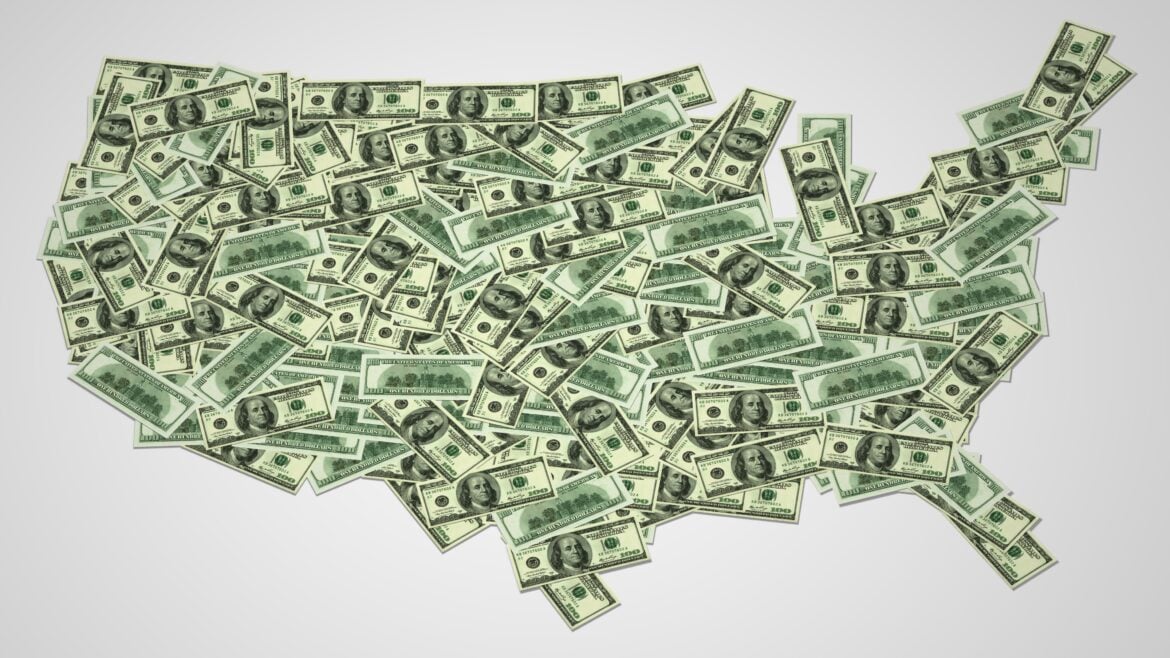 A digital illustration of the United States map created using overlapping one-hundred-dollar bills. The money is spread out to form the shape of the country, symbolizing financial distribution, economic policy, or funding allocation across the U.S. The background is a neutral gradient.