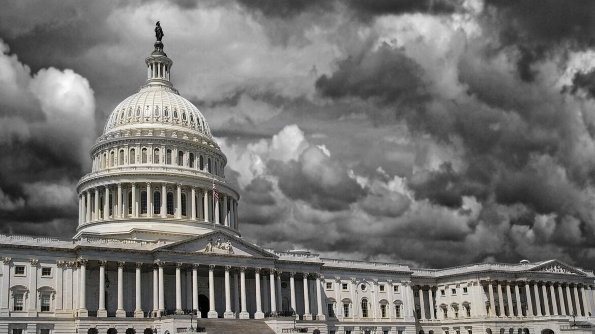 The United States Capitol in Washington DC with dark storm clouds