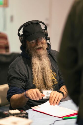 Scott Smith, general manager of Allegheny Mountain Radio, wearing headphones.