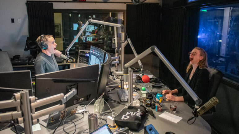 KEXP hosts John Richards and Morgan Chosnyk sit at microphones in the station's studio and sing along to Death Cab for Cutie's "Crooked Teeth" at 3:22 a.m. June 13.
