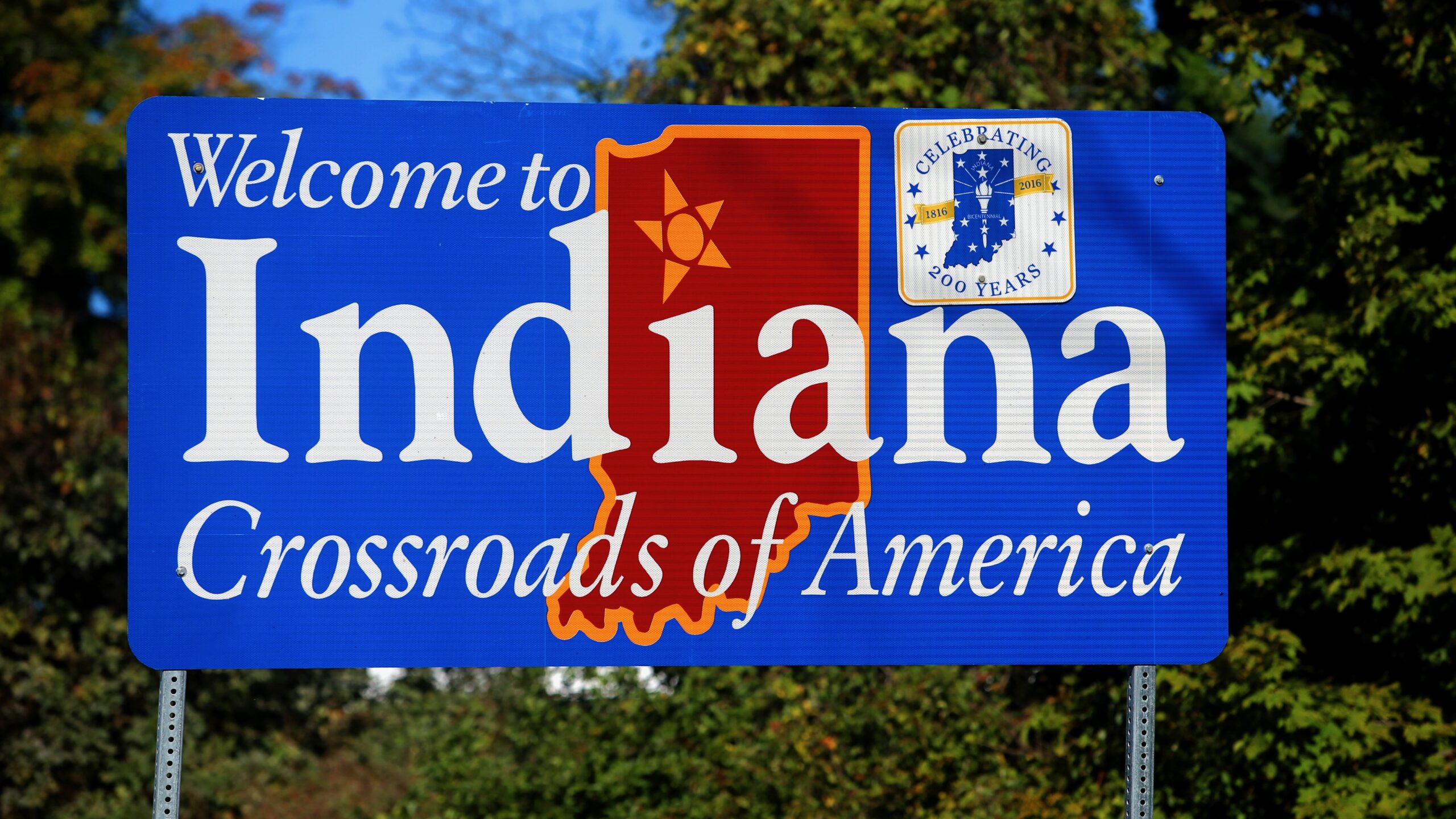 A sign that says "Welcome to Indiana, Crossroads of America"