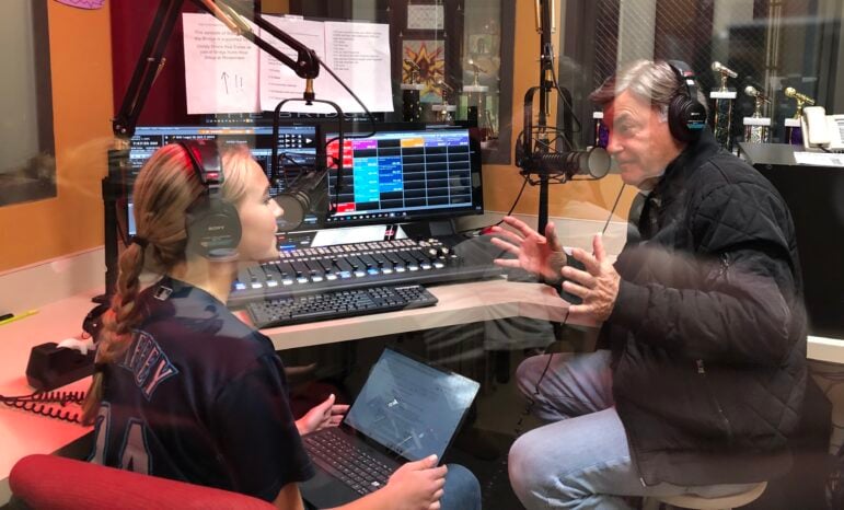 Marley McDonald, host of KMIH's "Breakfast with The Bridge," interviews Seattle Mariners radio play-by-play announcer Rick Rizzs