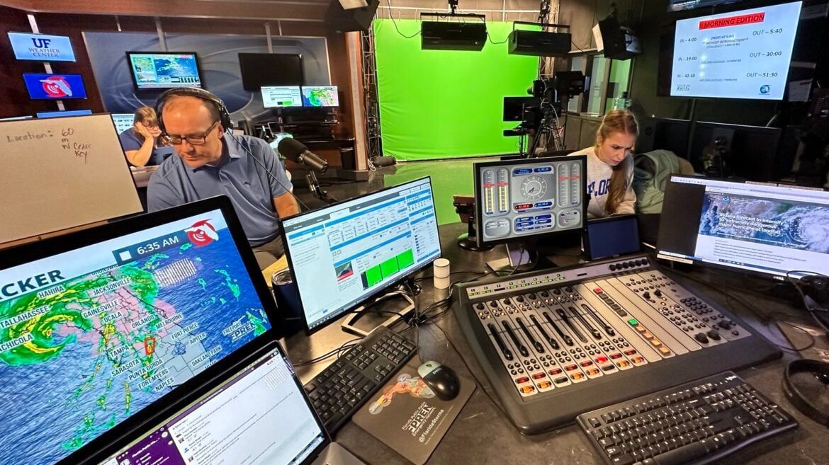 FPREN host Tom Hudson and senior meteorologist Megan Borowski at work in 2023, during live hurricane coverage that originated from WUFT in Gainesville.