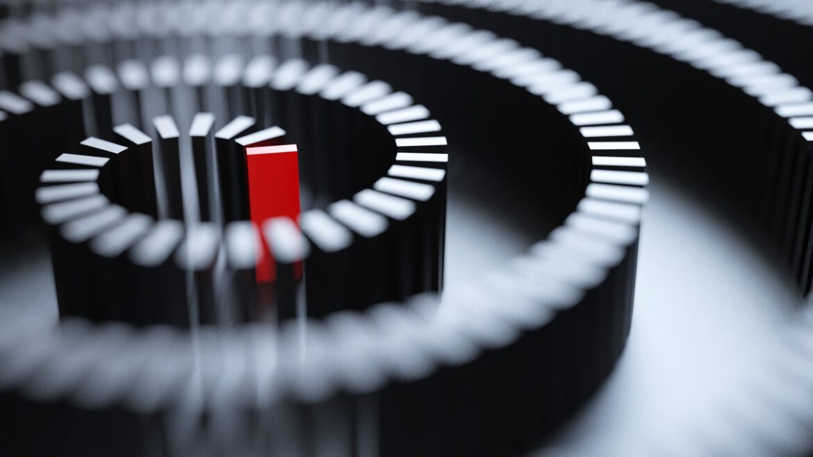 A conceptual image of a red domino at the center of a whirlpool-patterned chain of black dominos.