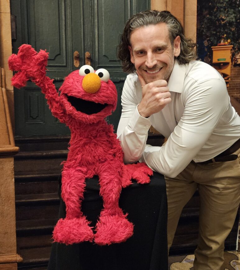 Elmo and Skyler Reep pose for a photo
