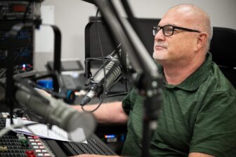 Stephen Yasko, GM of WFIT in Melbourne, Florida, sitting in a radio studio