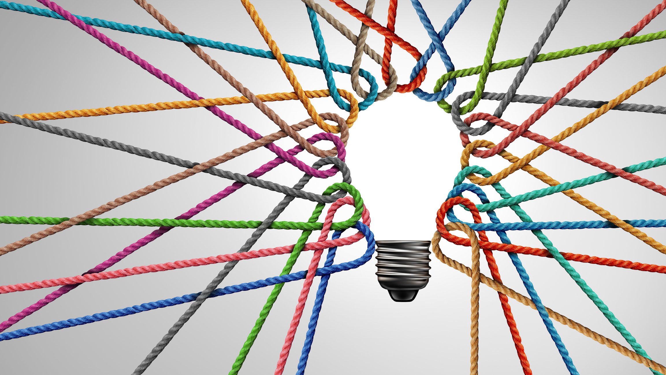 Multicolored ropes tied together in the shape of a light bulb, symbolizing collaboration and shared ideas.