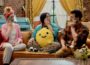 On an episode of How Are We Today?, Tyler, right, sits on a couch with his neighbors Barbara and Mariel. All three hold blue ice packs to their faces as part of an exercise for managing emotions. The scene takes place in a cozy, brightly colored living room with a brick wall, yellow curtains, and a blue piano in the background.
