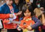 A child holds an instrument at New York Public Radio's Kids Fair in Queens in 2022.
