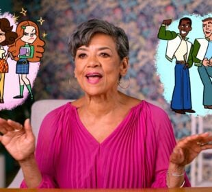 Sonia Manzano sits at a table in a brightly lit room, wearing a vibrant pink blouse and gesturing with her hands as she speaks. On either side of her, colorful cartoon illustrations appear: on the left, three stylish teenage girls stand with confident, dramatic poses; on the right, three teenage boys in letterman jackets smile and flex. The animated figures float against pastel backdrops, framing Manzano as she reflects in an interview for the documentary “Street Smart: Lessons From a TV Icon.”