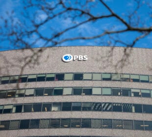 PBS' logo is featured at the top of its headquarters in Arlington, Va.