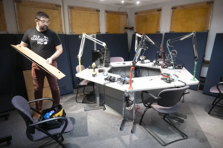 Production Director Sam Wisman packs up inside a talk show studios.