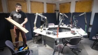 KCUR Production Director Sam Wisman packs up inside a talk show studios.