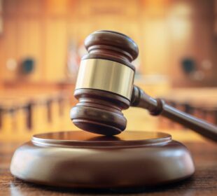 Judges gavel in court room legal trial and law background