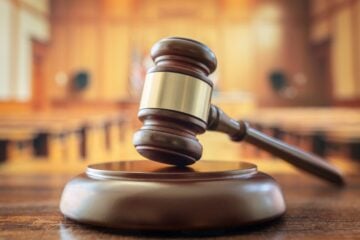 Judges gavel in court room legal trial and law background