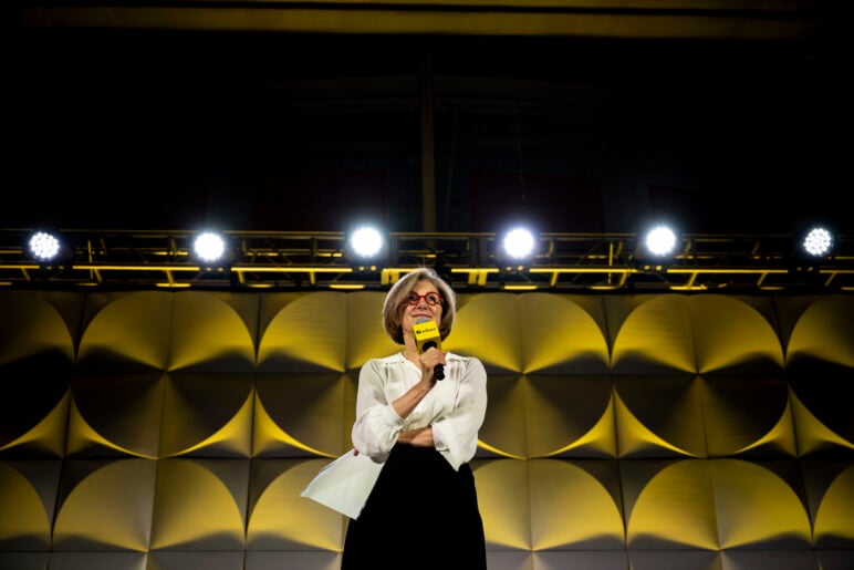 WBUR CEO Margaret Low speaking on stage at WBUR's debut festival. 
