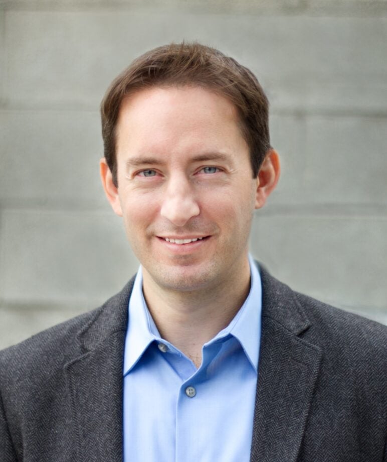 Headshot of Ben Bradford, creator of the podcast "Are We Doomed?"