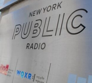 New York Public Radio's logo on a sign outside its headquarters in New York City (Headshot)