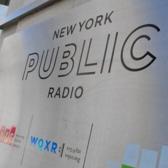 New York Public Radio's logo on a sign outside its headquarters in New York City (Headshot)