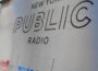 New York Public Radio's logo on a sign outside its headquarters in New York City (Headshot)