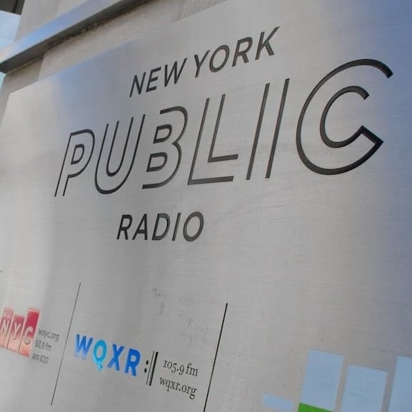 New York Public Radio's logo on a sign outside its headquarters in New York City (Headshot)