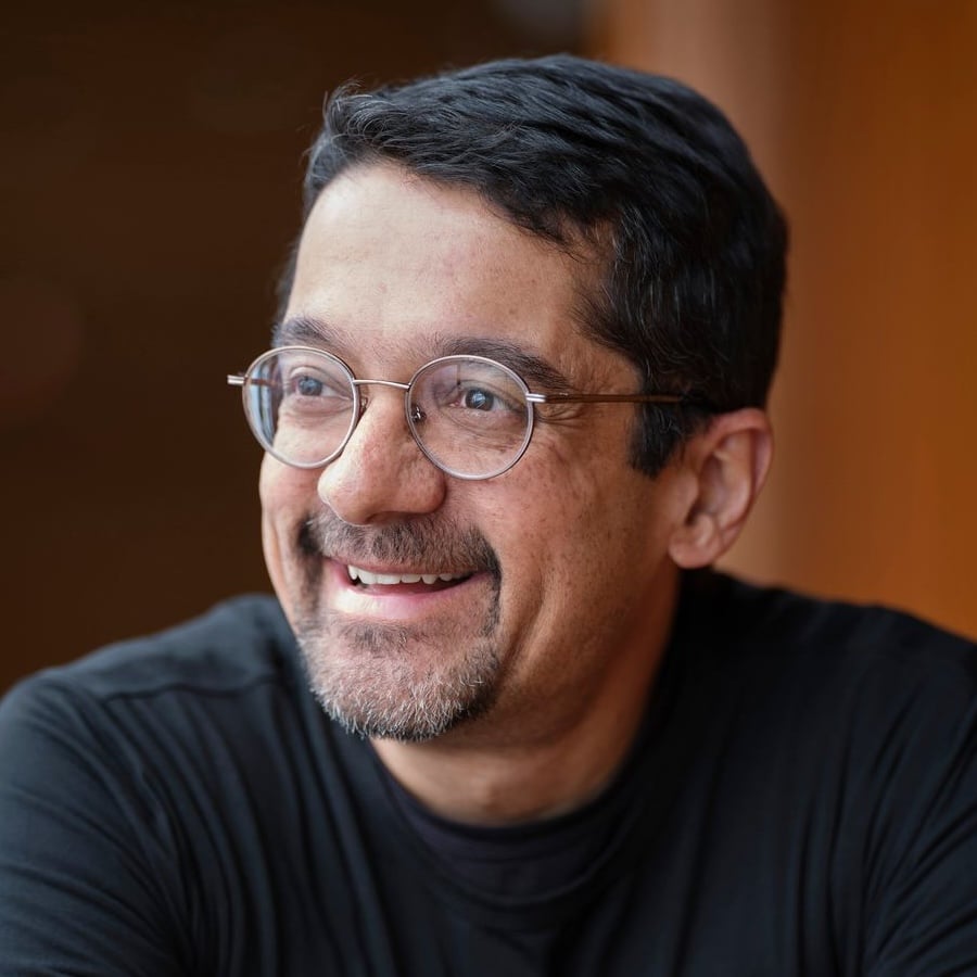 Headshot of Hidden Brain host Shankar Vedantam looking away