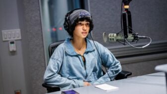 Eumari King Perez, a student whose ”Podcasting Democracy“ submission was featured on-air, sits in a KQED studio in June.