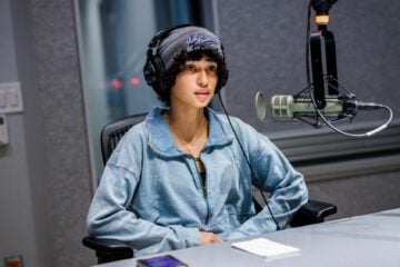 Eumari King Perez, a student whose ”Podcasting Democracy“ submission was featured on-air, sits in a KQED studio in June.