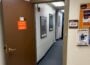 An open door leads into the KTEP-FM studios at the University of Texas at El Paso. A sign identifies the entrance as “206 KTEP FM Studios,” while campus flyers hang on a bulletin board outside the studio hallway.
