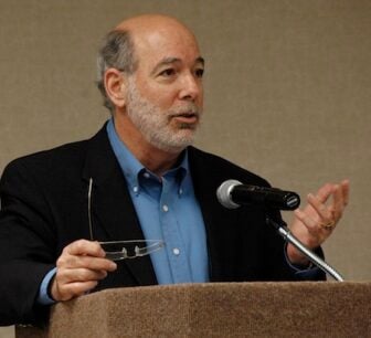 Headshot of Mark Erstling speaking at a PBS meeting in 2007.