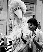 Big Bird and children in scene from Sesame
    Street