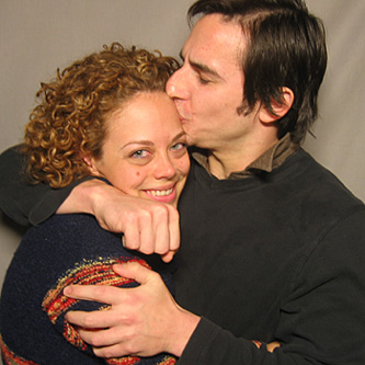 Couple embracing, looking very happy
