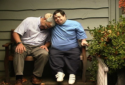 Jon hugs his father on the porch.