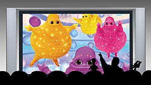 Watching roly-poly Boohbah creatures on widescreen set