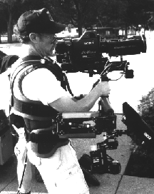 KCTS videographer with hefty HD camera in 1990s