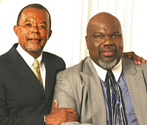 Gates poses with his arm around Jakes