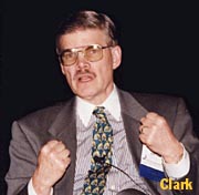 Clark speaks at a 1997 meeting