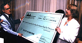 Mayor Giuliani and Laura Walker with very large blowup of check