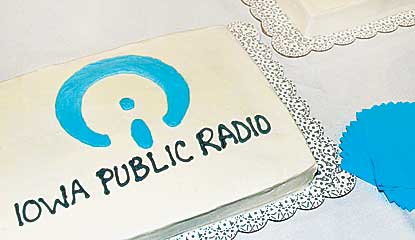 Rectangular, white-iced cakes say "Iowa Public Radio" in blue icing