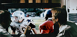Technicians observing wide DTV screen