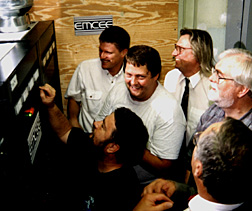 Engineers cluster in front of big black box
